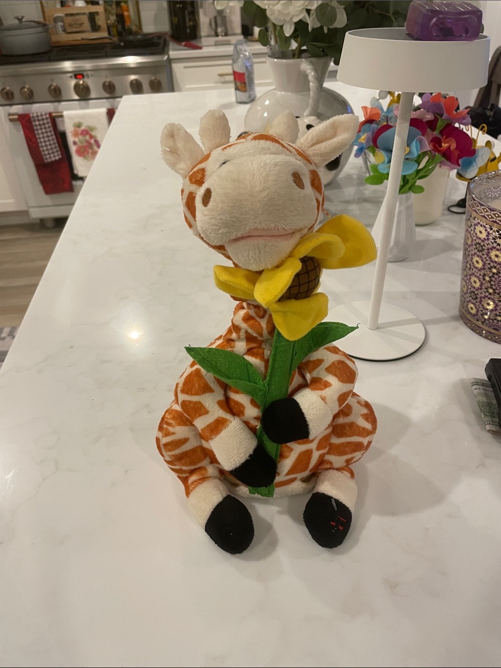 Plush singing Giraffe Holding Yellow Sunflower Stuffed Animal